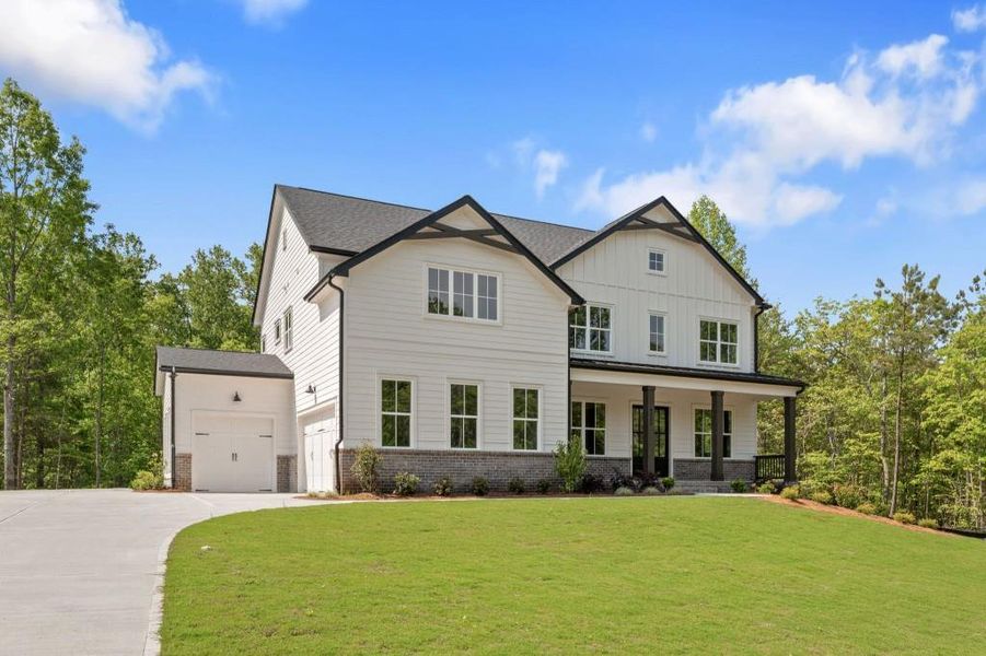 Front exterior of a new home in Arden on Lanier, Cumming, GA, highlighting curb appeal (Image 20). Front exterior of a new home in Arden on Lanier, Cumming, GA, highlighting curb appeal (Image 20).