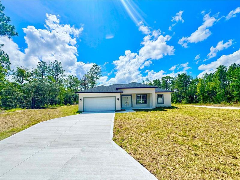 Front exterior of a new home in , Dunnellon, FL, highlighting curb appeal (Image 18).