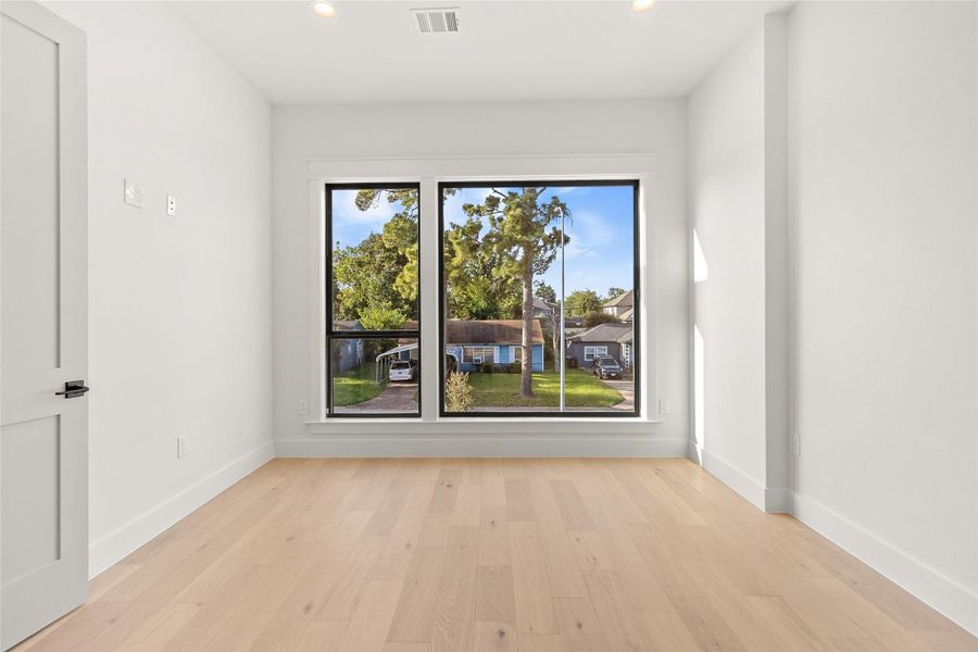 Retreat to this spacious secondary bedroom, where large windows invite an abundance of natural light. Featuring its own private en-suite bath, this oversized room offers comfort and flexibility to suit your needs.
