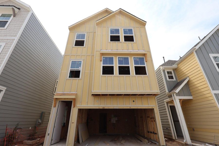 Three story home with 4 beds, 3.5 baths, and 2 car garage