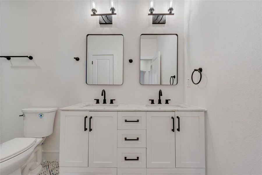 Bathroom with vanity and toilet