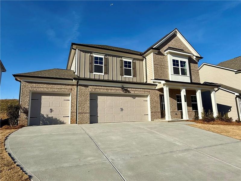 Front exterior of a new home in Ponderosa Farms Manor, Gainesville, GA, highlighting curb appeal (Image 23).
