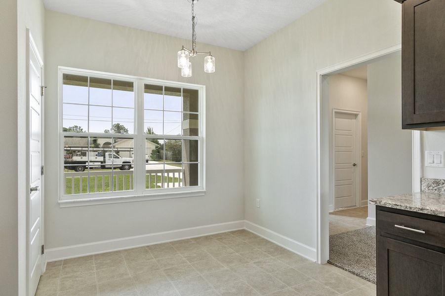 Representative unfurnished interior of a home built from the 2705 by Adams Homes in Winding Oaks, Weeki Wachee (Image 13).
