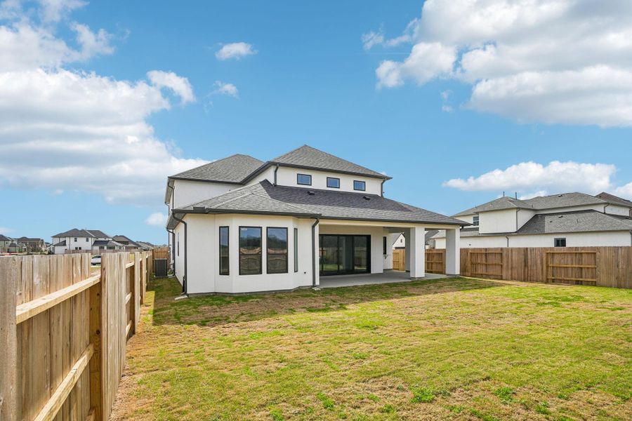 Exterior details and patio area of a home in Del Bello Lakes 60', Manvel (Image 29).