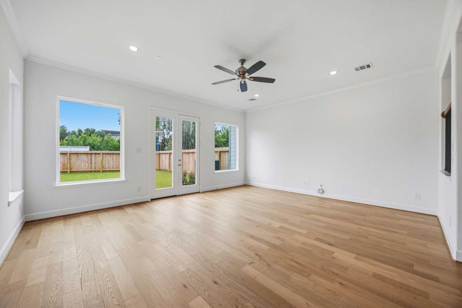 Bright and inviting, with a ceiling fan and recessed lights, the living room is the perfect spot for any activity.