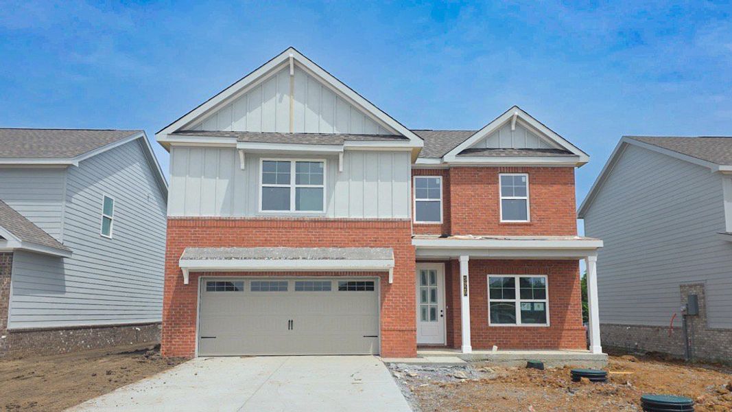 *Photo of actual home under construction May 2026. Home will have painted brick.