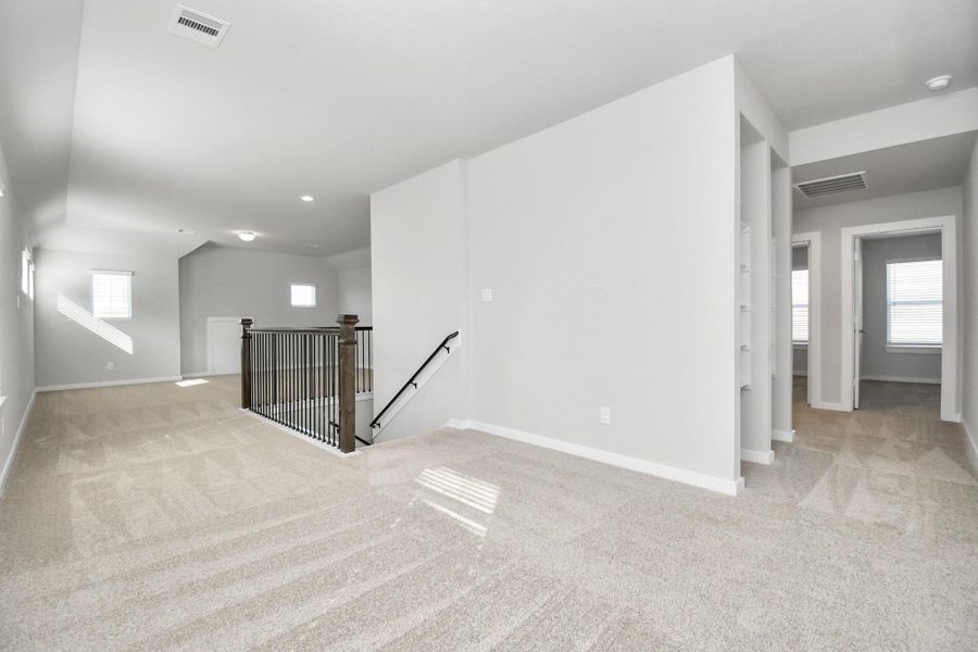 Another perspective of the upstairs loft! Sample photo of completed home with similar floor plan. Actual colors and selections may vary.