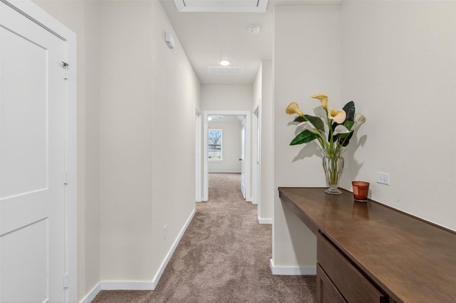 Light-filled upper-level hallway featuring a built-in workspace, offering a functional and stylish area for work, study, or organization. Light-filled upper-level hallway featuring a built-in workspace, offering a functional and stylish area for work, study, or organization.