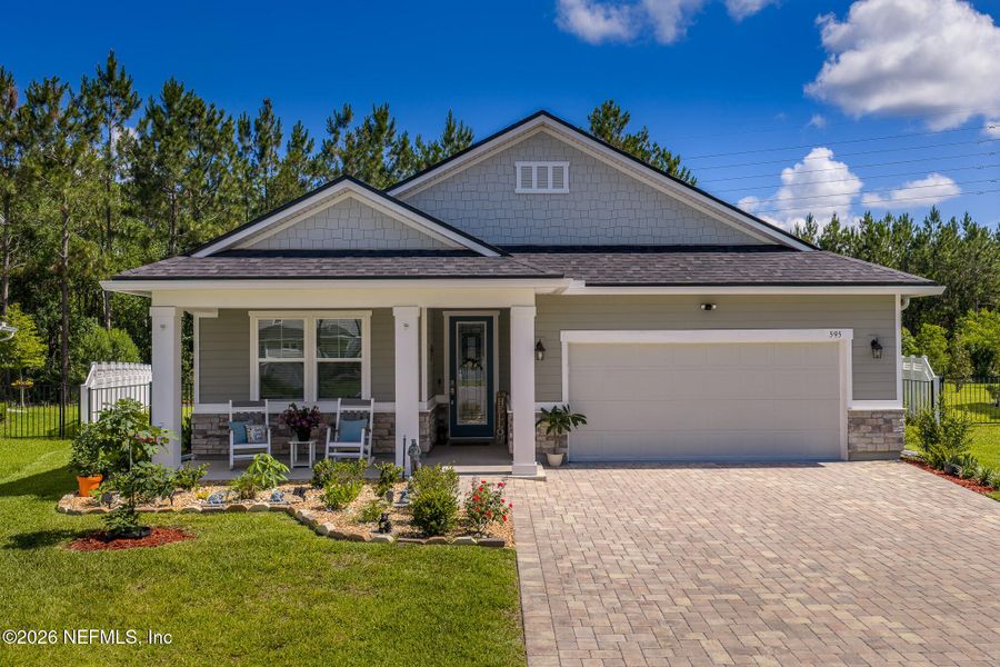 Front exterior of a new home in Elm Creek at Silverleaf, St. Augustine, FL, highlighting curb appeal (Image 21). Front exterior of a new home in Elm Creek at Silverleaf, St. Augustine, FL, highlighting curb appeal (Image 21).