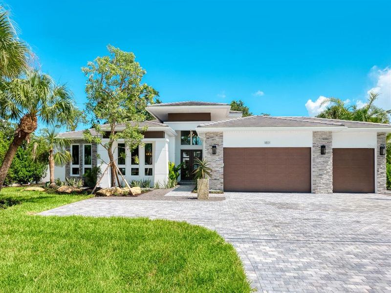 Front exterior of a new home in , Sarasota, FL, highlighting curb appeal (Image 2).