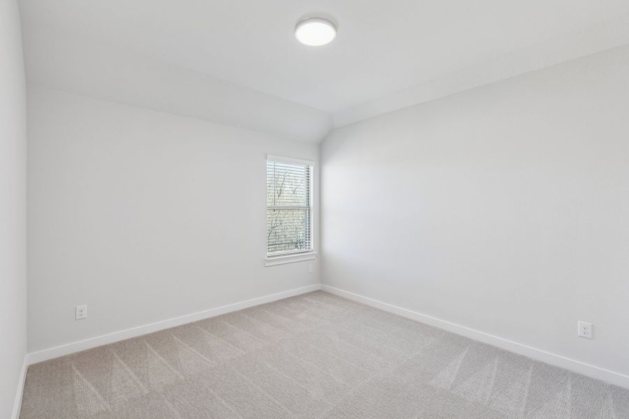 Bedroom in the Masters home plan by Trophy Signature Homes – REPRESENTATIVE PHOTO