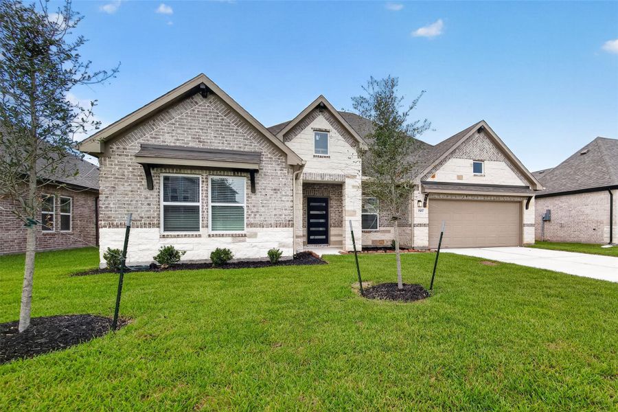 Front exterior of a new home in Foxtail Palms, Manvel, TX, highlighting curb appeal (Image 23).