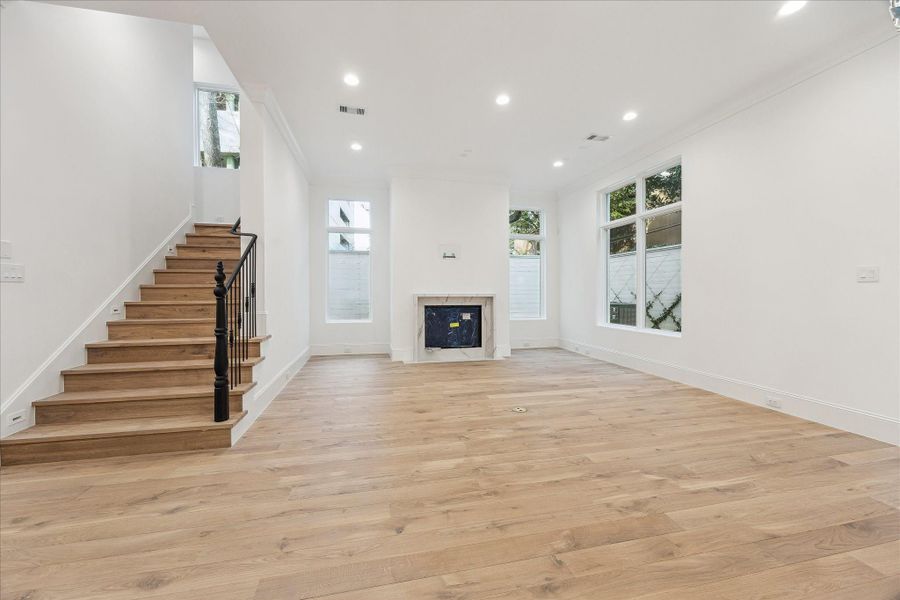 Plenty of room for seating in this expansive and bright living room.