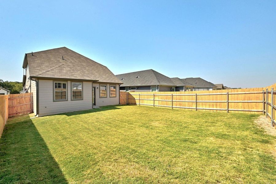 Exterior details and patio area of a home in Trinity Ranch, Elgin (Image 22). Exterior details and patio area of a home in Trinity Ranch, Elgin (Image 22).