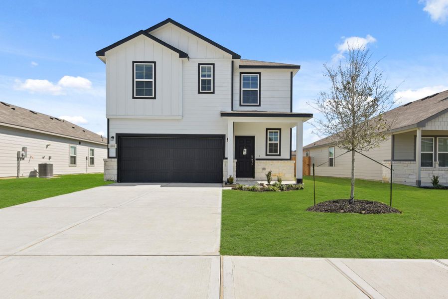 Front exterior of a new home in The Villages at Westpointe, Dayton, TX, highlighting curb appeal (Image 17). Front exterior of a new home in The Villages at Westpointe, Dayton, TX, highlighting curb appeal (Image 17).