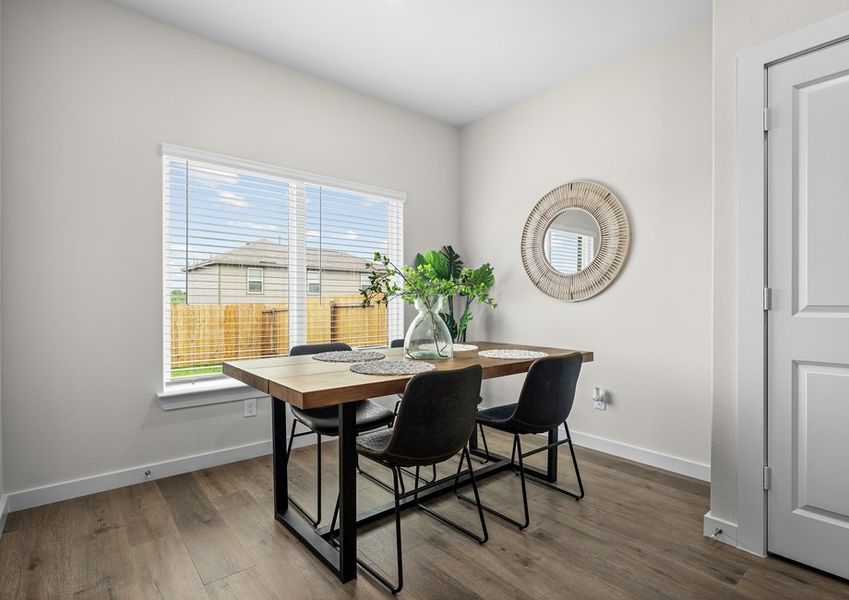 The dining room has a wonderful window that lets in great, natural light.