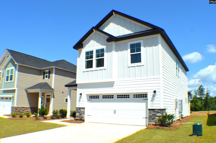 Front exterior of a new home in Bickley Station, Irmo, SC, highlighting curb appeal (Image 21). Front exterior of a new home in Bickley Station, Irmo, SC, highlighting curb appeal (Image 21).