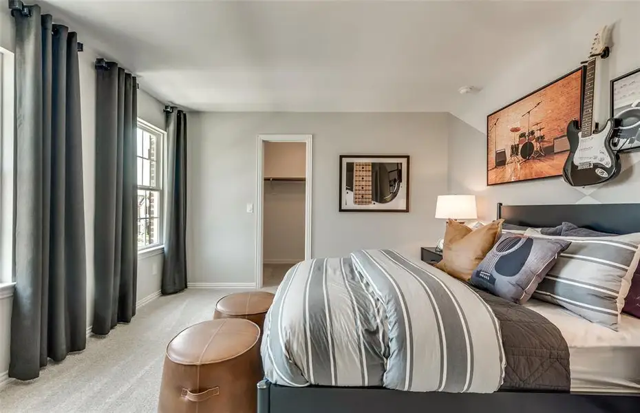 *Model Representation - Spacious secondary bedroom with large windows