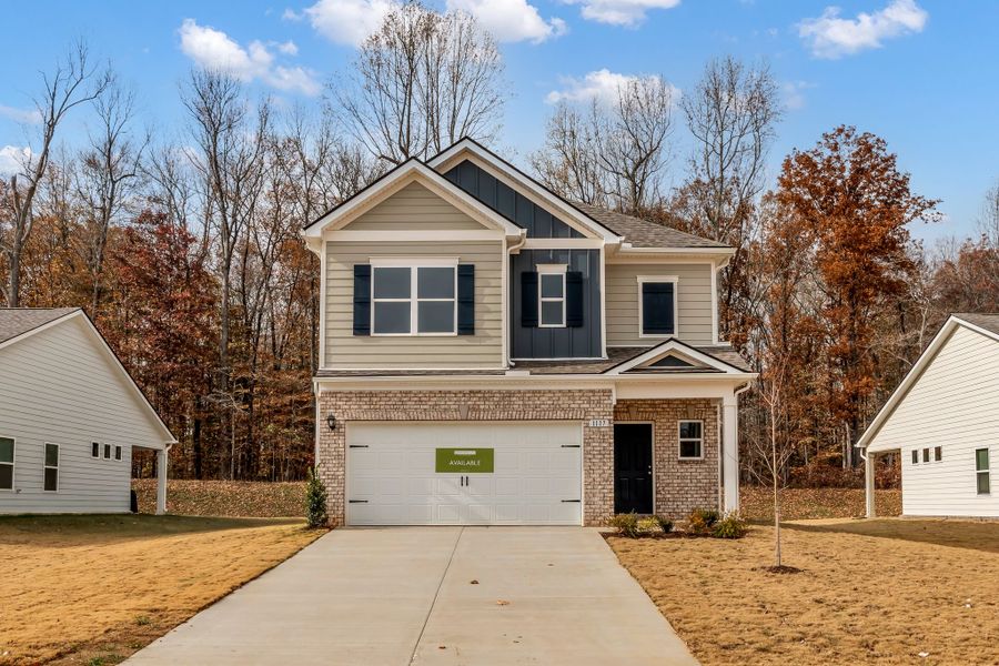Front exterior of a new home in Marlin Pointe, White House, TN, highlighting curb appeal (Image 1). Front exterior of a new home in Marlin Pointe, White House, TN, highlighting curb appeal (Image 1).