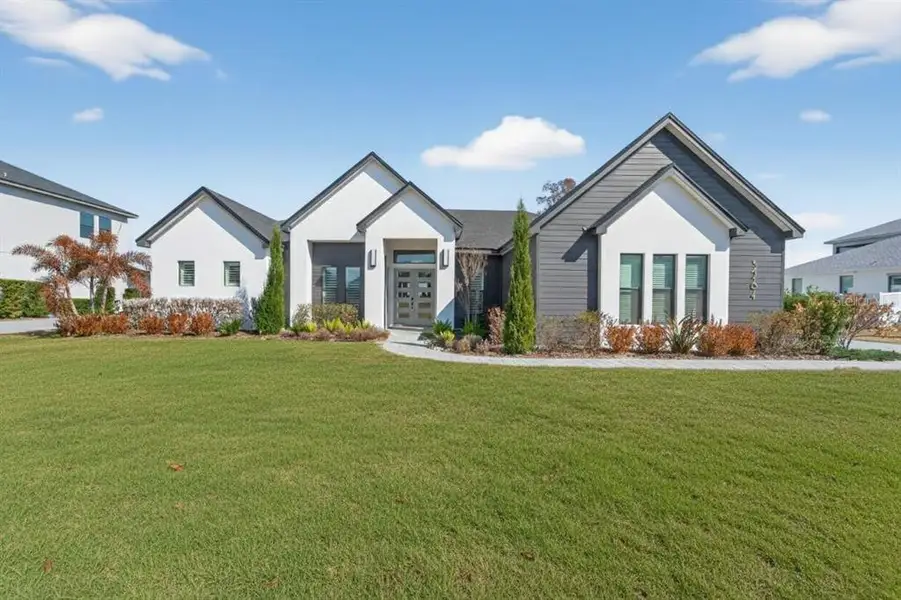 Front exterior of a new home in , Bartow, FL, highlighting curb appeal (Image 27).