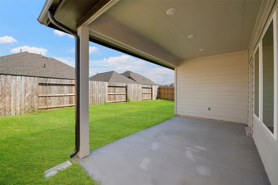 Covered patio provides shade and comfort for weekend get-togethers.