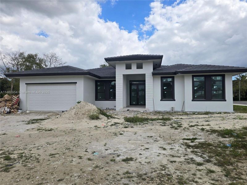 Front exterior of a new home in , Miami, FL, highlighting curb appeal (Image 22).