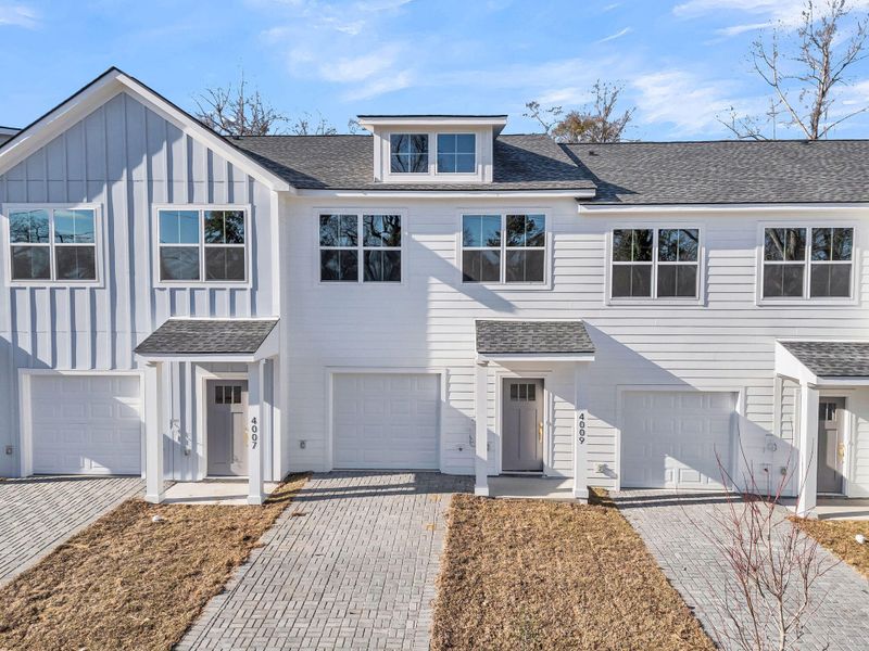 Front exterior of a new home in , North Charleston, SC, highlighting curb appeal (Image 1). Front exterior of a new home in , North Charleston, SC, highlighting curb appeal (Image 1).