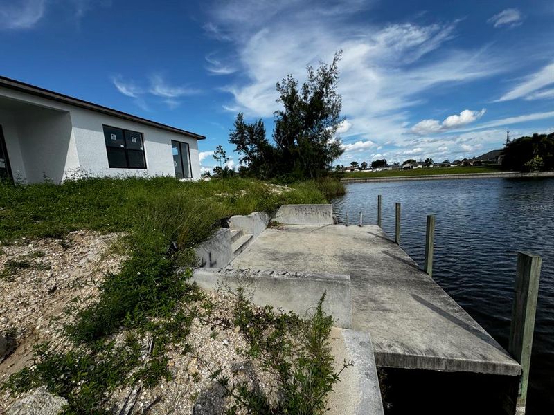 Front exterior of a new home in , Cape Coral, FL, highlighting curb appeal (Image 1). Front exterior of a new home in , Cape Coral, FL, highlighting curb appeal (Image 1).