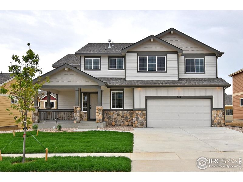 Front exterior of a new home in Southridge, Johnstown, CO, highlighting curb appeal (Image 1).