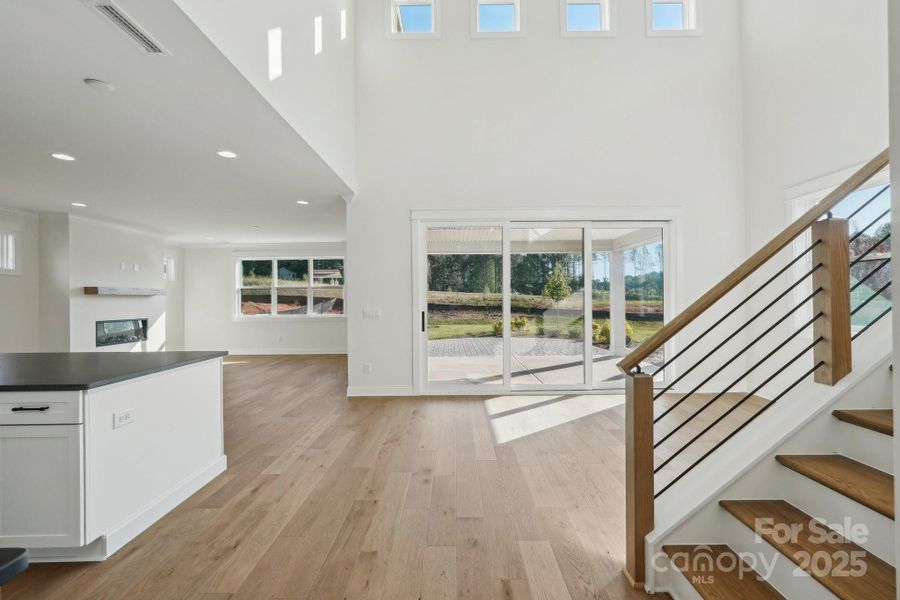 foyer view of kitchen/dining/great room