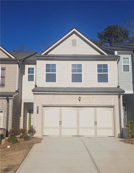 Front exterior of a new home in Mulberry Summit, Flowery Branch, GA, highlighting curb appeal (Image 1). Front exterior of a new home in Mulberry Summit, Flowery Branch, GA, highlighting curb appeal (Image 1).
