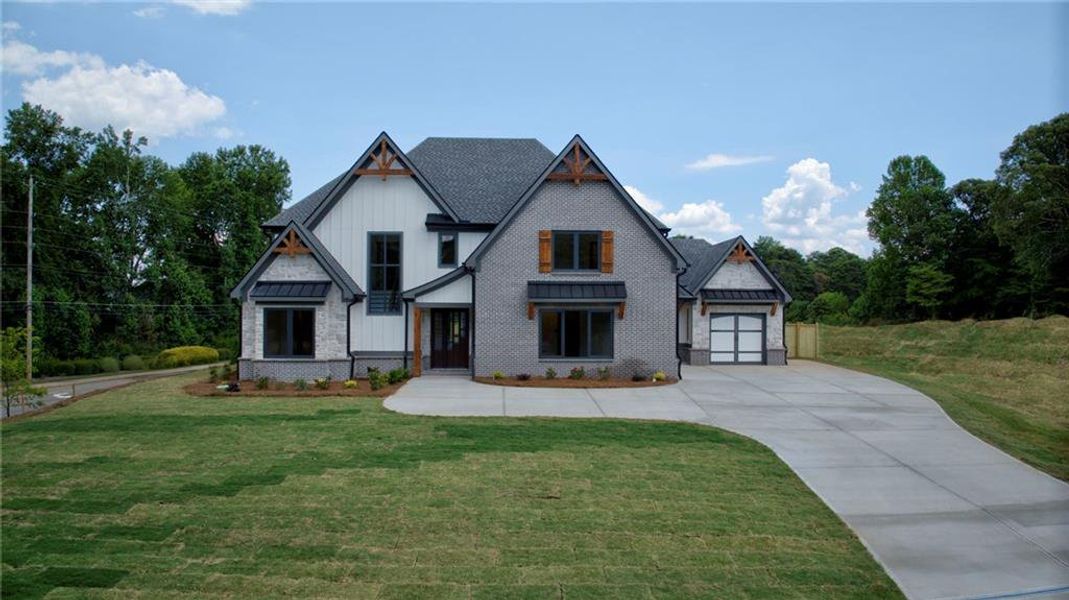 Front exterior of a new home in , Sugar Hill, GA, highlighting curb appeal (Image 33).