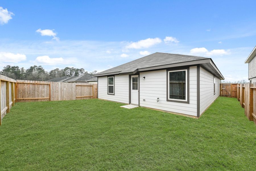 Exterior details and patio area of a home in The Canopies, Splendora (Image 18).