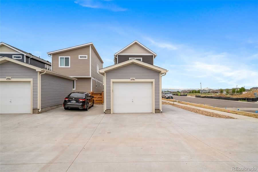 Exterior details and patio area of a home in Reunion, Commerce City (Image 29).
