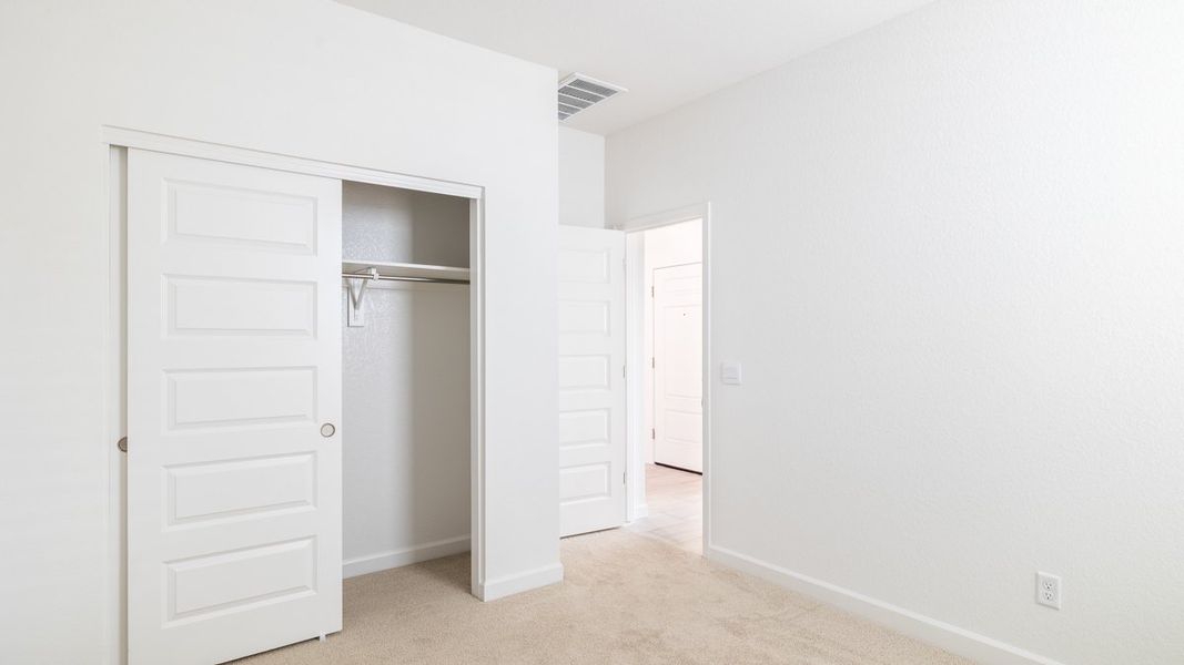 Spacious, unfurnished interior of a new home in Zanjero Pass, Waddell (Image 24).