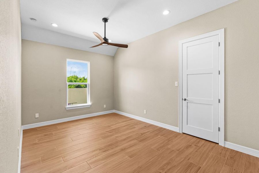 Additional secondary bedroom featuring a bright, open layout with neutral tones and contemporary details.