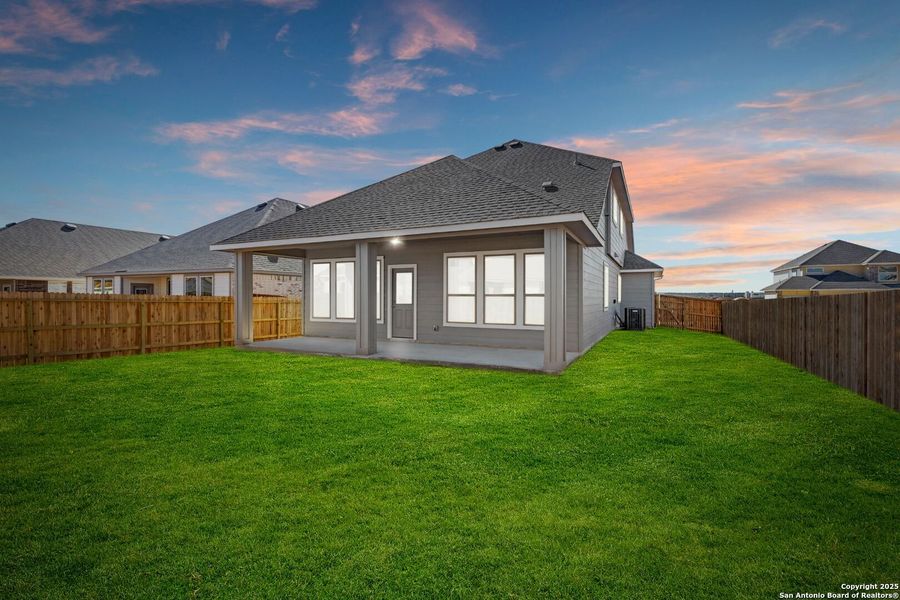 Front exterior of a new home in Megan's Landing, Castroville, TX, highlighting curb appeal (Image 14). Front exterior of a new home in Megan's Landing, Castroville, TX, highlighting curb appeal (Image 14).