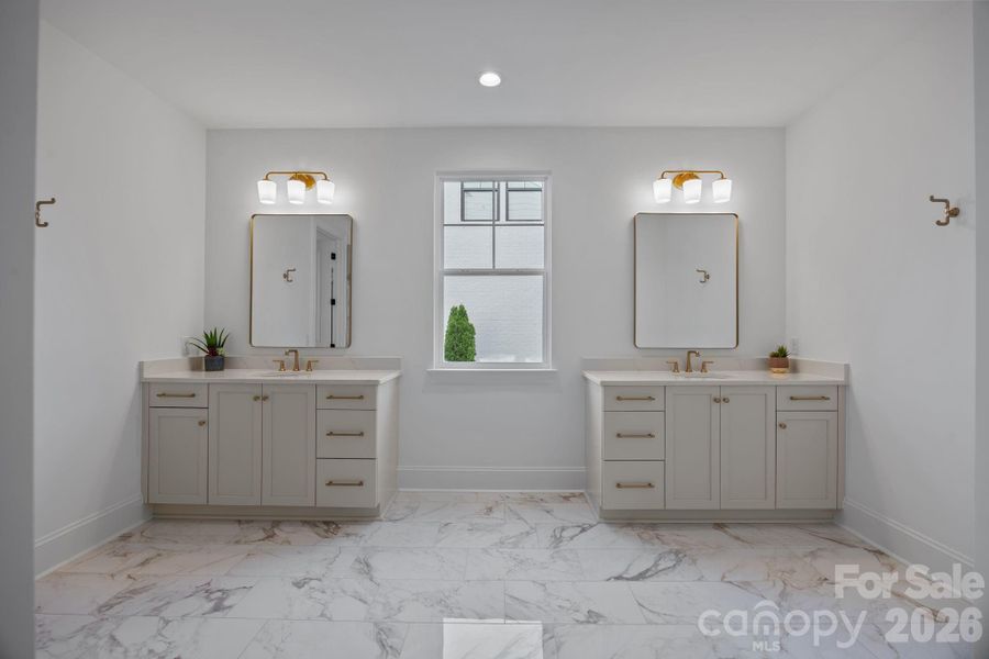 Separate sink vanities with quartz countertops