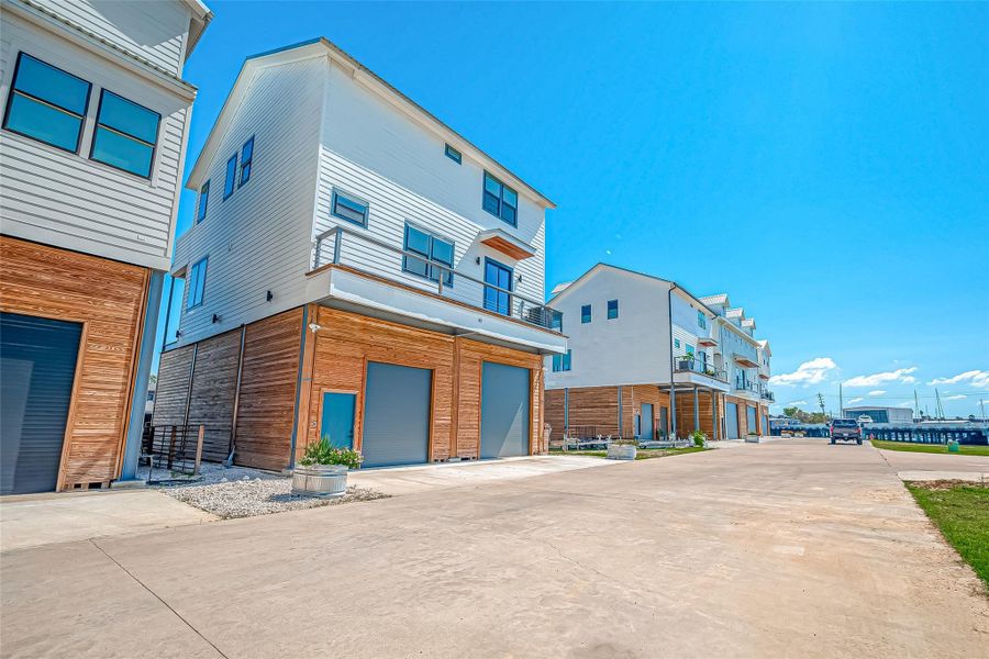 Front exterior of a new home in , Taylor Lake Village, TX, highlighting curb appeal (Image 9).
