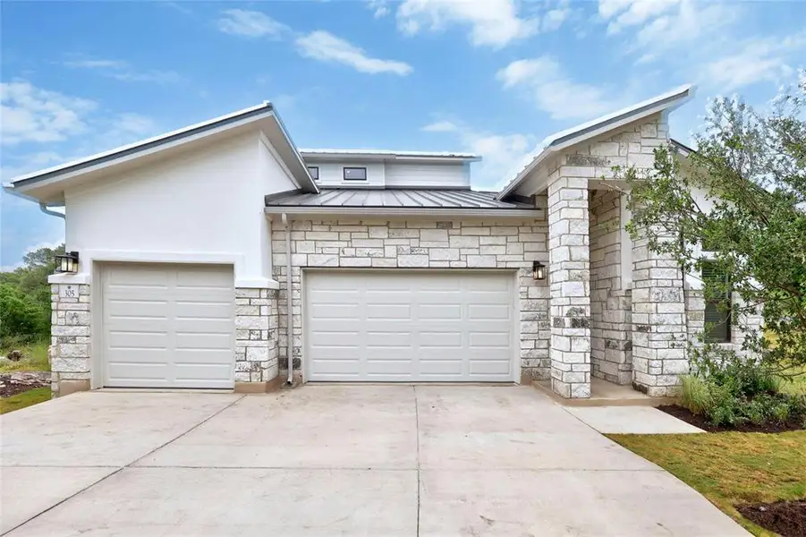 Front exterior of a home in the Horseshoe Bay community, located in Horseshoe Bay, TX (Image 1).