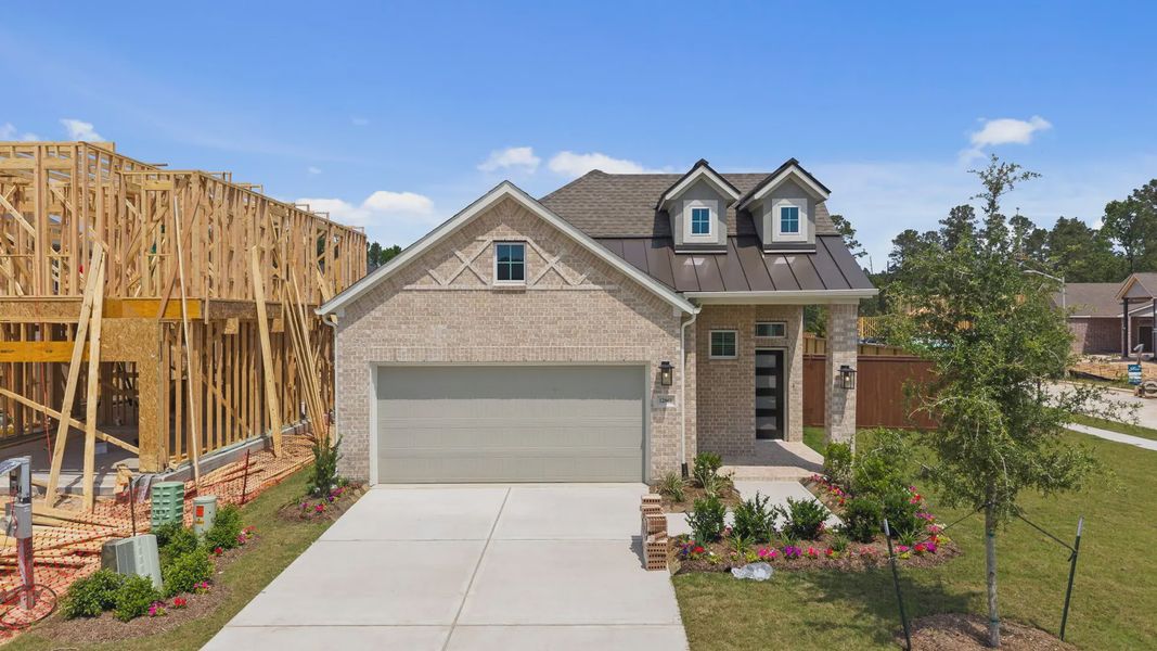 Front exterior of a new home in Evergreen 40s, Conroe, TX, highlighting curb appeal (Image 2). Front exterior of a new home in Evergreen 40s, Conroe, TX, highlighting curb appeal (Image 2).