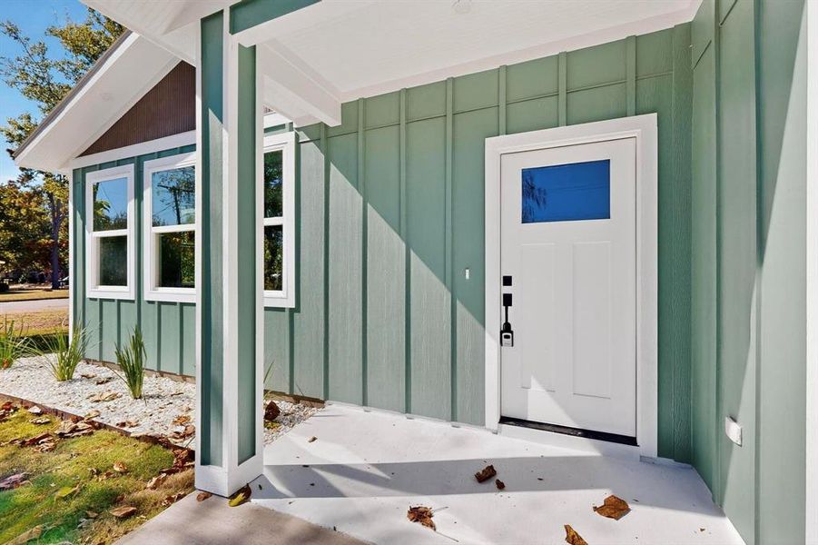 Entrance to property featuring board and batten siding Entrance to property featuring board and batten siding
