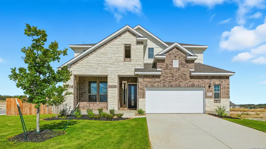 Front exterior of a new home in Buffalo Crossing, Cibolo, TX, highlighting curb appeal (Image 1). Front exterior of a new home in Buffalo Crossing, Cibolo, TX, highlighting curb appeal (Image 1).