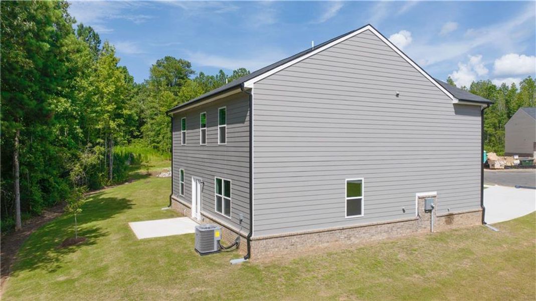 Front exterior of a new home in The Reserve at Calcutta, Stockbridge, GA, highlighting curb appeal (Image 25). Front exterior of a new home in The Reserve at Calcutta, Stockbridge, GA, highlighting curb appeal (Image 25).