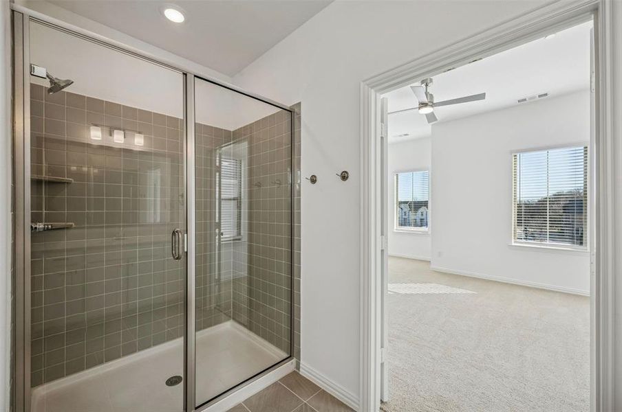 You'll enjoy long, luxurious showers in this oversized walk in owner's bath shower!