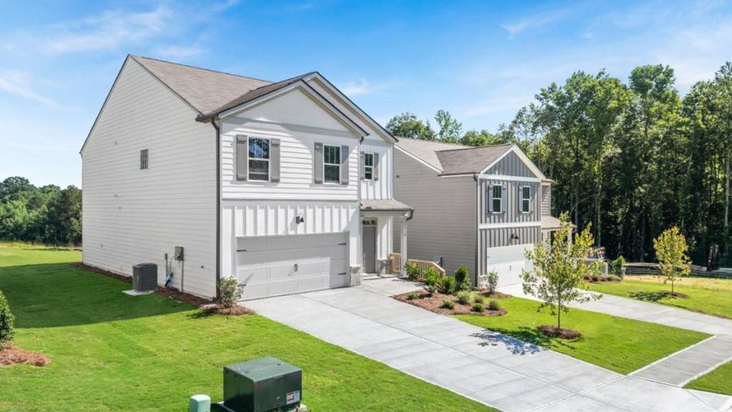 Front exterior of a new home in Oconee Overlook, Gainesville, GA, highlighting curb appeal (Image 1). Front exterior of a new home in Oconee Overlook, Gainesville, GA, highlighting curb appeal (Image 1).