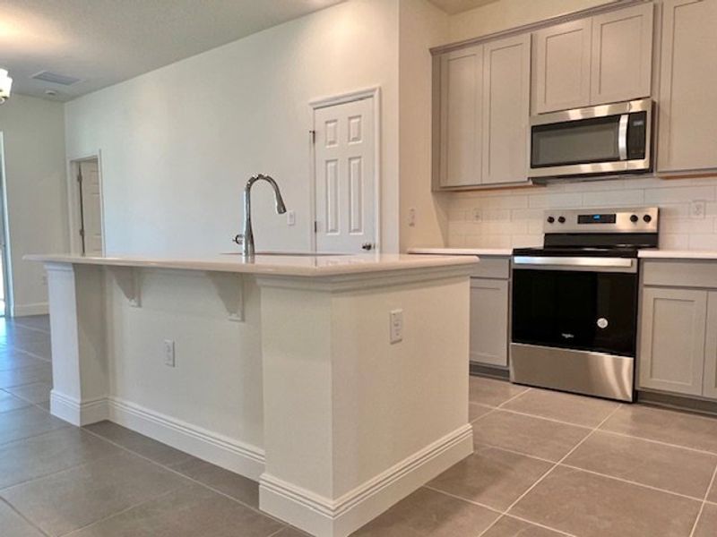 Furnished interior view inside a new home in Lakes At St Sebastian, Micco (Image 9).