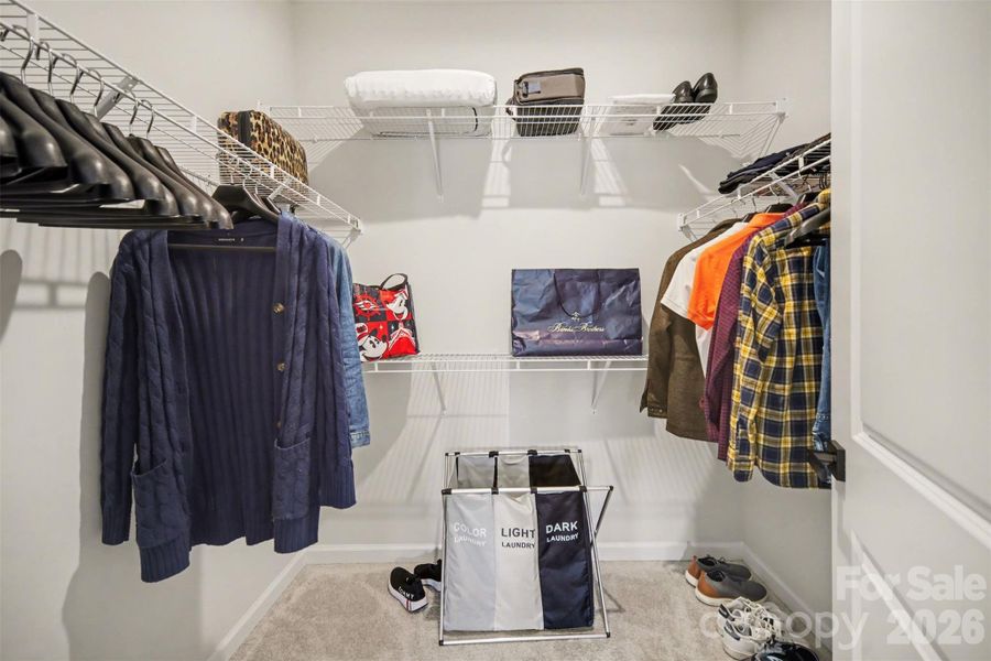 Spacious primary bedroom walk-in closet