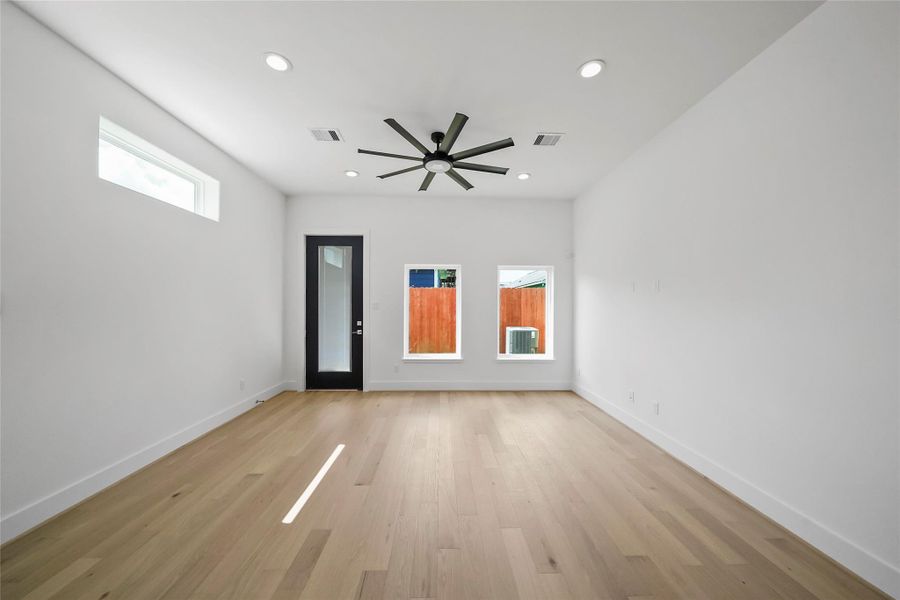 Abundant natural light floods the room through elevated windows. Abundant natural light floods the room through elevated windows.