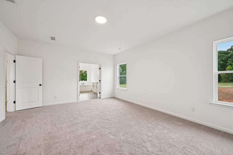 Representative unfurnished interior of a home built from the Macon by Ashton Woods in Rowland's Grant, Fuquay Varina (Image 47).